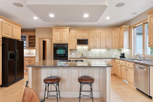 809 Saint Moritz, Victoria, MN 55386 - kitchen with black appliances, light brown cabinetry, a sink, light wood-style flooring, and recessed lighting
