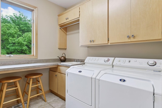 809 Saint Moritz, Victoria, MN 55386 - washroom with independent washer and dryer, cabinet space, and light tile patterned floors