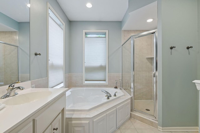809 Saint Moritz, Victoria, MN 55386 - bathroom featuring a garden tub, vanity, a shower stall, and tile patterned floors