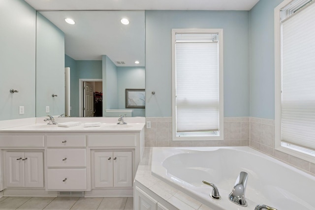 809 Saint Moritz, Victoria, MN 55386 - bathroom with a bath, double vanity, tile patterned floors, a spacious closet, and recessed lighting