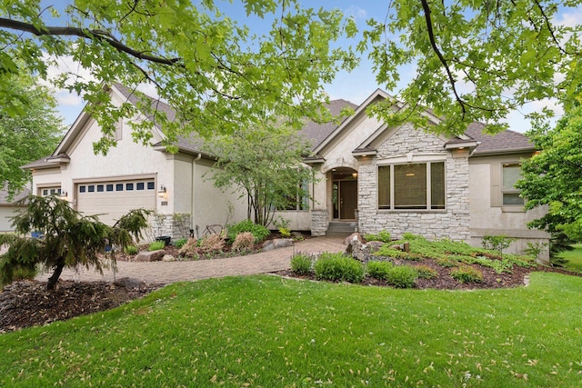 809 Saint Moritz, Victoria, MN 55386 - view of front facade featuring stone siding, stucco siding, a front yard, an attached garage, and driveway