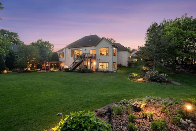 809 Saint Moritz, Victoria, MN 55386 - rear view of house with stairway, a yard, stucco siding, and a wooden deck