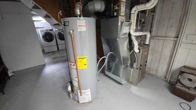 utilities with heating unit, independent washer and dryer, and gas water heater