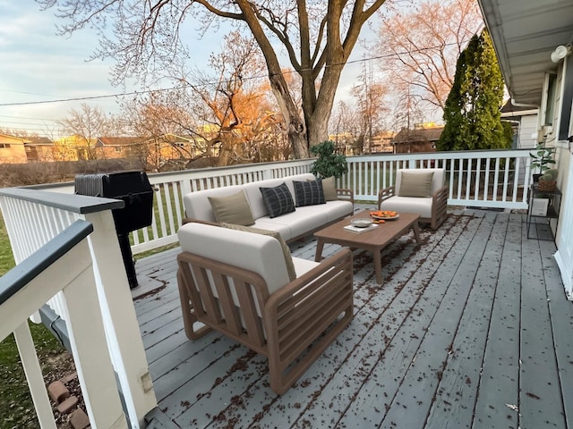 wooden terrace featuring an outdoor living space