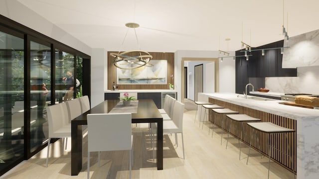 dining room featuring an inviting chandelier and light wood finished floors