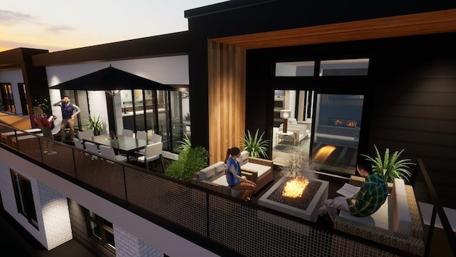 balcony featuring an outdoor fire pit