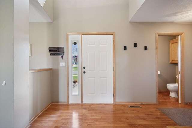 2797 Ocarina Dr, Sauk Rapids, MN 56379 - entryway featuring baseboards, visible vents, and light wood-style flooring