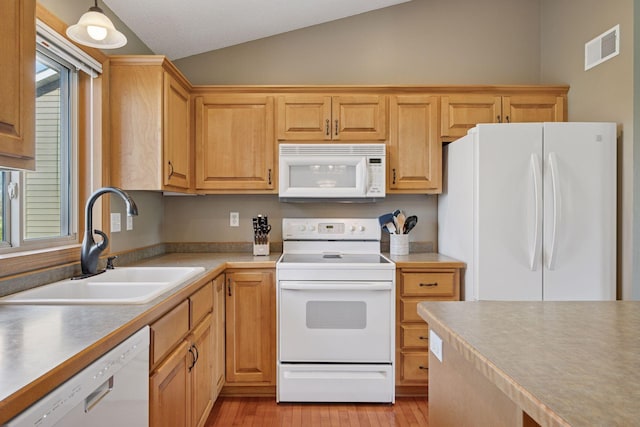 2797 Ocarina Dr, Sauk Rapids, MN 56379 - kitchen with visible vents, white appliances, light wood-style floors, a sink, and vaulted ceiling