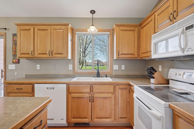 2797 Ocarina Dr, Sauk Rapids, MN 56379 - kitchen with a sink, white appliances, light countertops, decorative light fixtures, and visible vents