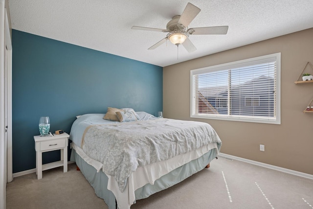 2797 Ocarina Dr, Sauk Rapids, MN 56379 - bedroom with ceiling fan, carpet floors, baseboards, and a textured ceiling