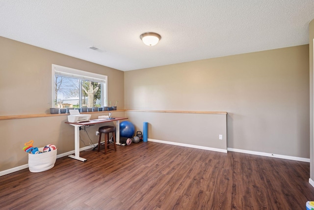 2797 Ocarina Dr, Sauk Rapids, MN 56379 - home office featuring visible vents, baseboards, and wood finished floors