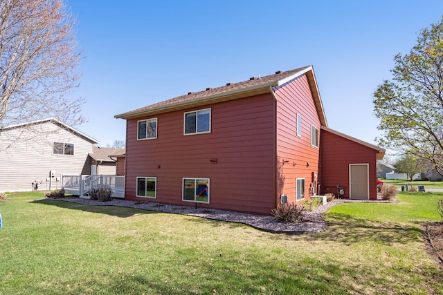 2797 Ocarina Dr, Sauk Rapids, MN 56379 - back of house featuring a lawn and a deck