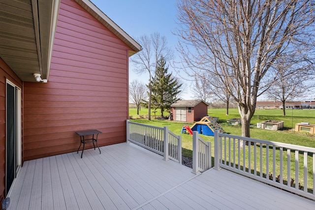2797 Ocarina Dr, Sauk Rapids, MN 56379 - wooden terrace featuring a yard, a shed, and an outbuilding