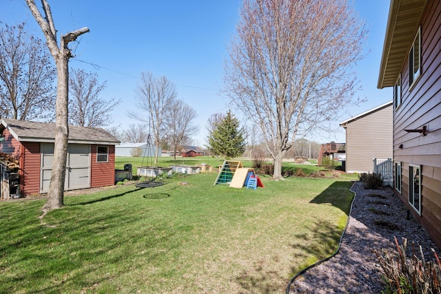 2797 Ocarina Dr, Sauk Rapids, MN 56379 - view of yard with a storage unit and an outdoor structure