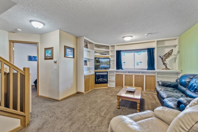 carpeted living area with stairs, a textured ceiling, and baseboards