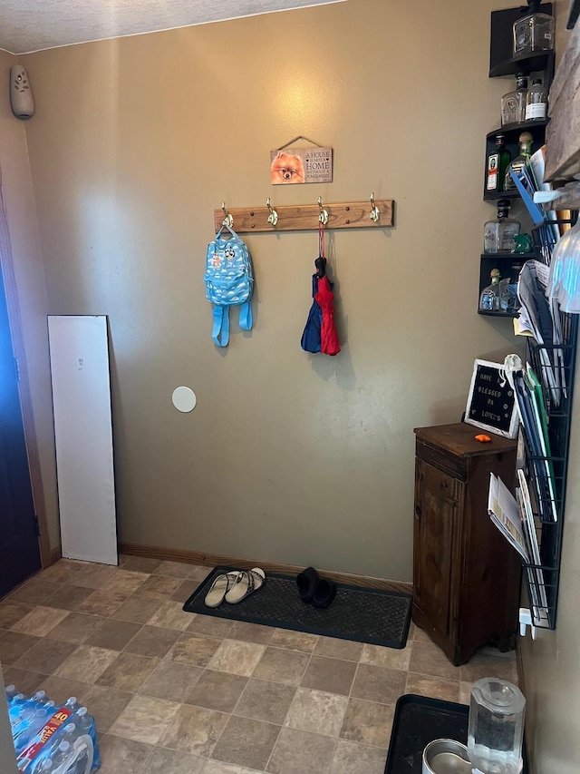 822 Holcombe Ave N, Litchfield, MN 55355 - interior space featuring baseboards and stone finish flooring