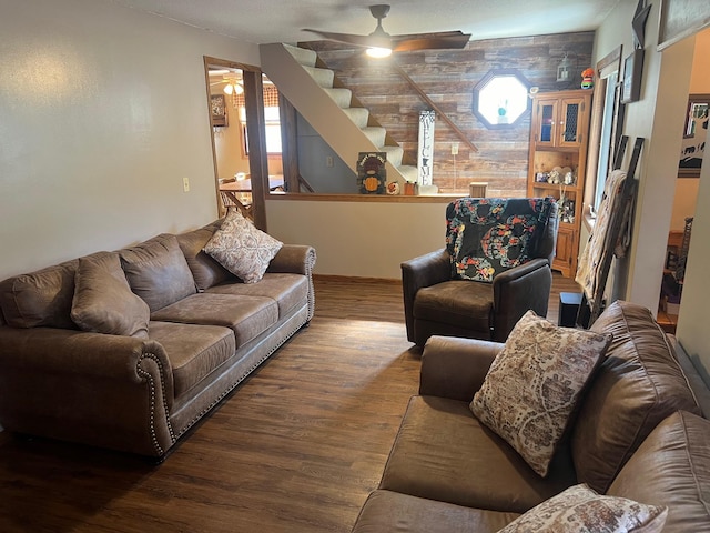 822 Holcombe Ave N, Litchfield, MN 55355 - living area featuring baseboards, a ceiling fan, wood finished floors, and stairway