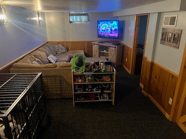 822 Holcombe Ave N, Litchfield, MN 55355 - living room with wooden walls, a wainscoted wall, and carpet