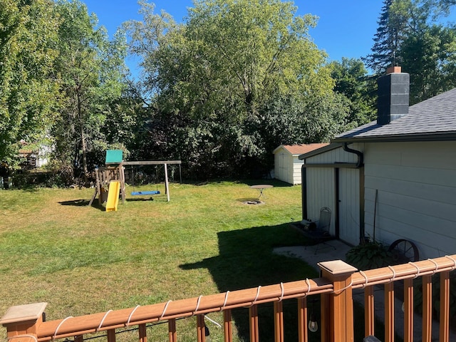 822 Holcombe Ave N, Litchfield, MN 55355 - view of yard with a storage unit, an outdoor structure, and a playground