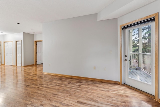 2530 34th St Unit 111, Minneapolis, MN 55406 - spare room featuring light wood-style flooring and baseboards