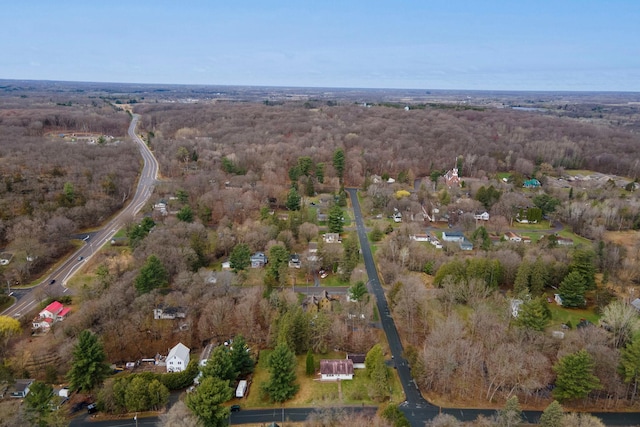 bird's eye view featuring a wooded view