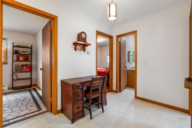 office featuring baseboards and tile patterned floors