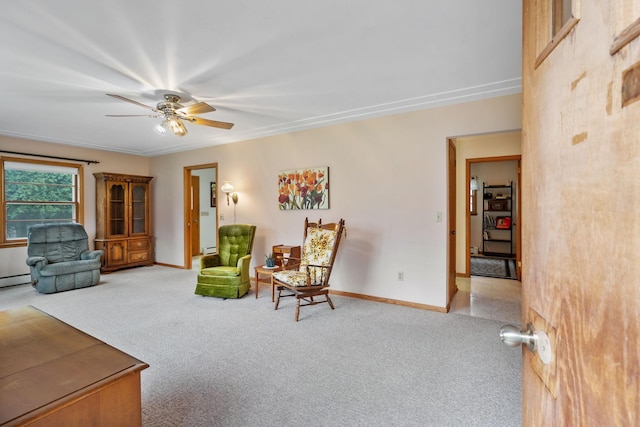 interior space with carpet floors, ceiling fan, and baseboards