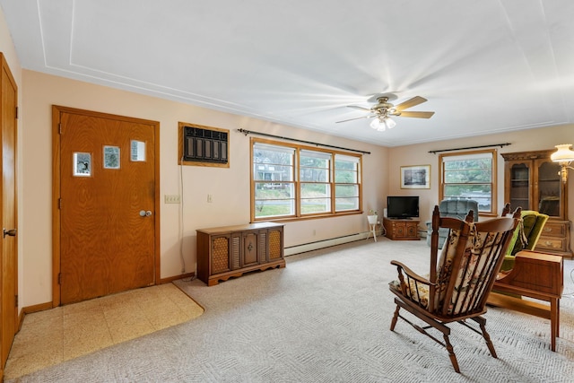 interior space with baseboards, ceiling fan, a wall unit AC, and baseboard heating