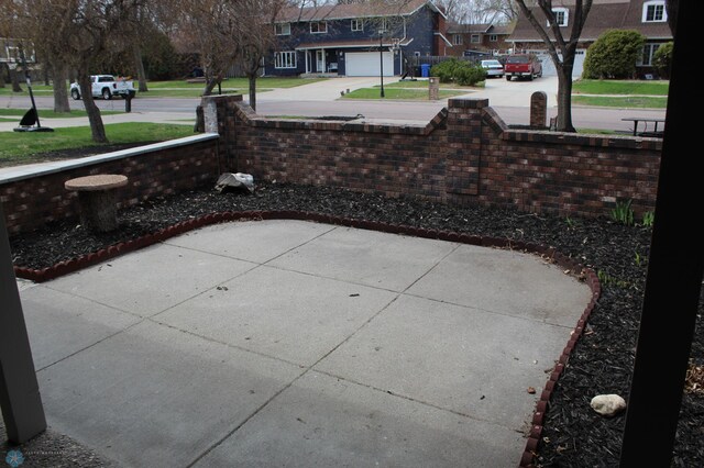 view of patio with a residential view