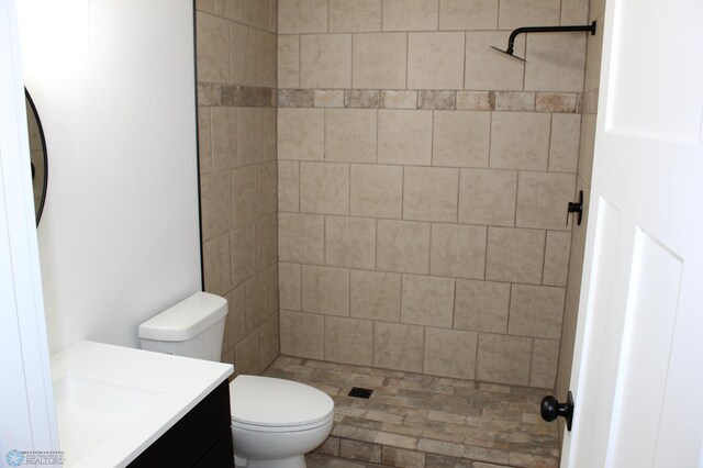 full bath with toilet, a shower stall, and vanity