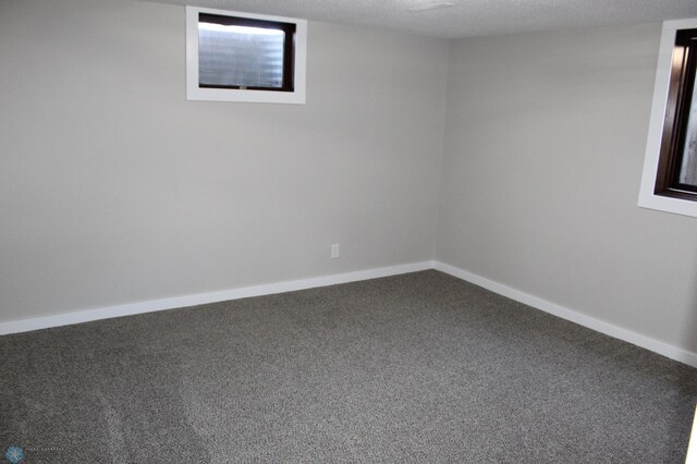 interior space featuring carpet flooring and baseboards
