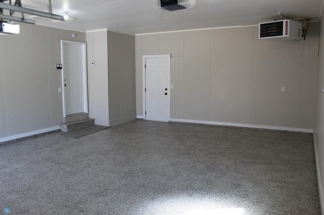 garage with a garage door opener and a heating unit