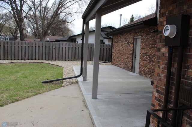 view of patio / terrace featuring fence