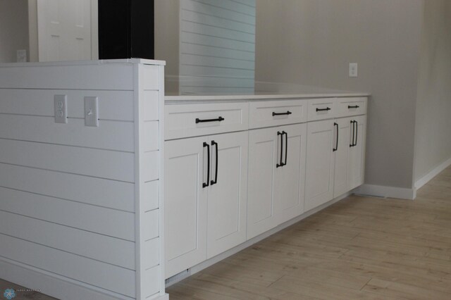 details featuring baseboards and wood finished floors