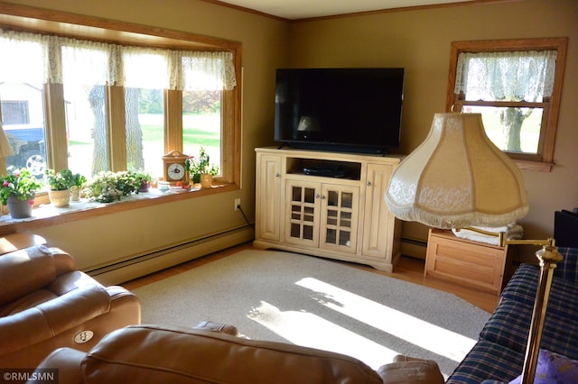 living room featuring light wood finished floors and a baseboard heating unit