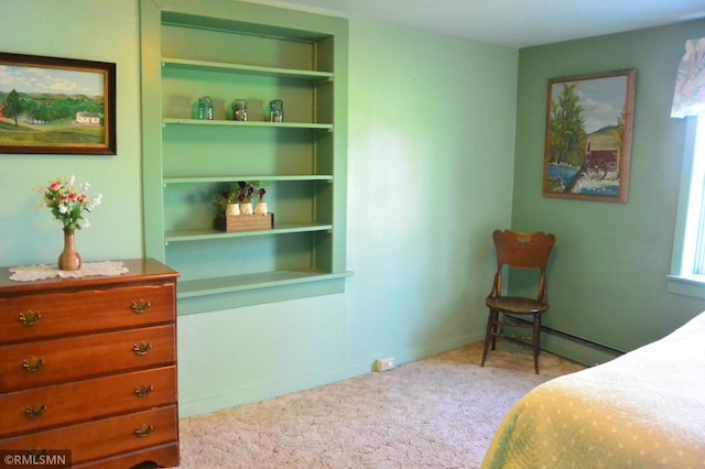 carpeted bedroom featuring a baseboard radiator