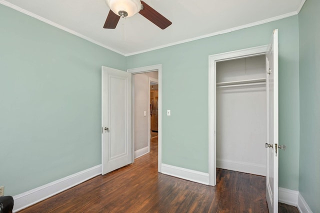 unfurnished bedroom with baseboards, ornamental molding, and dark wood-style flooring