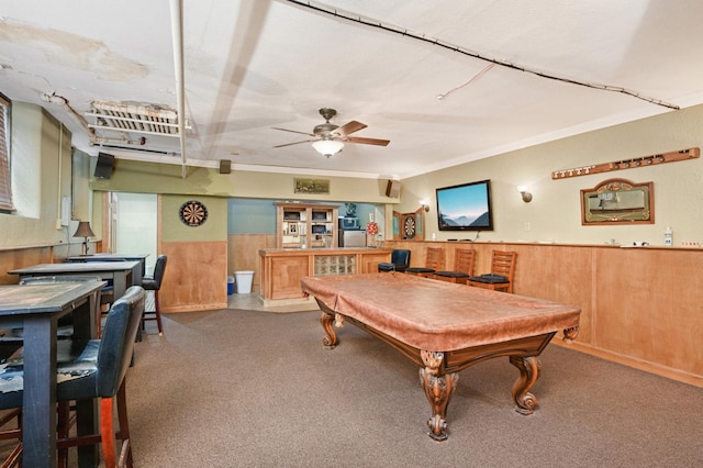 recreation room featuring ceiling fan, pool table, wainscoting, ornamental molding, and carpet