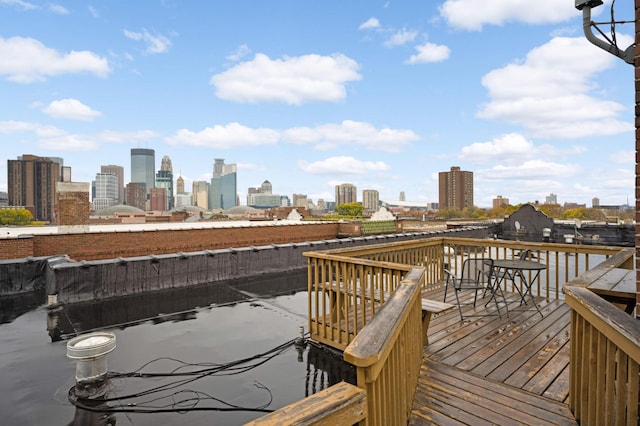 wooden deck with a view of city