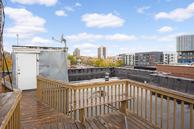 wooden deck with a view of city