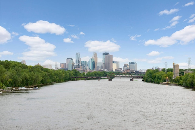 surrounding community with a view of city and a water view