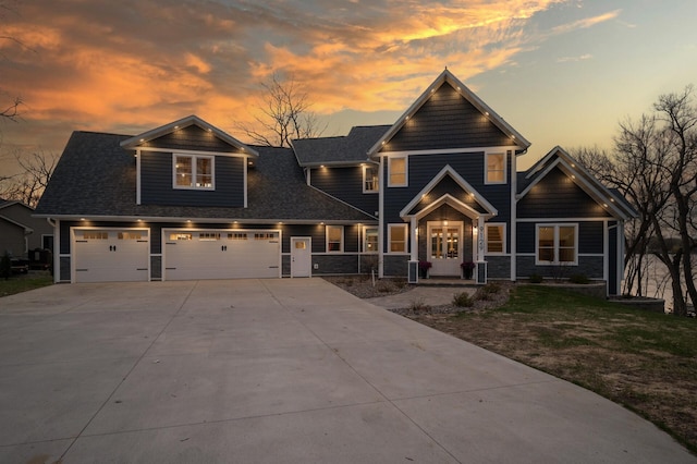 view of front of property with a garage and driveway