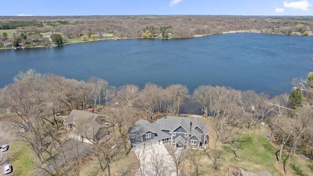 aerial view featuring a water view and a forest view