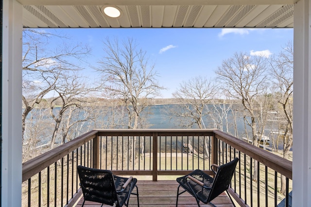 wooden terrace with a water view