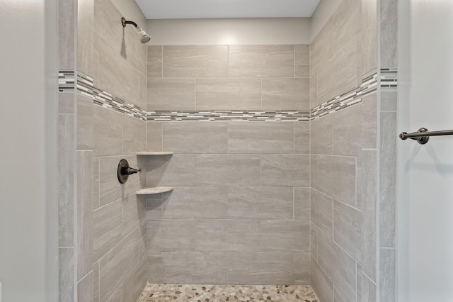 full bath with tiled shower