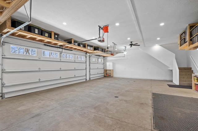 garage with recessed lighting, ceiling fan, and a garage door opener