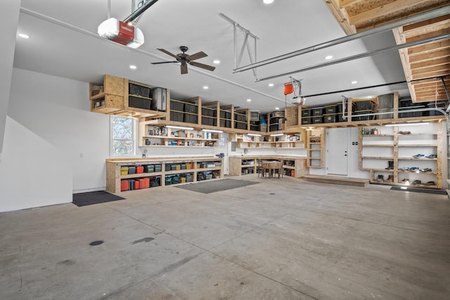 garage featuring recessed lighting and a garage door opener