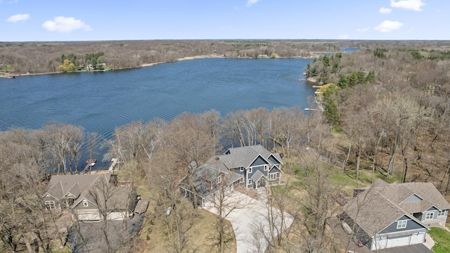 bird's eye view featuring a view of trees and a water view