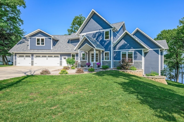 9129 279th Ave NW, Zimmerman, MN 55398 - craftsman inspired home with concrete driveway, a front lawn, stone siding, and roof with shingles