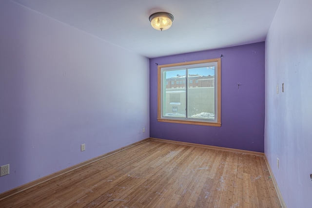 304 3rd Ave, Virginia, MN 55792 - unfurnished room featuring baseboards and wood finished floors